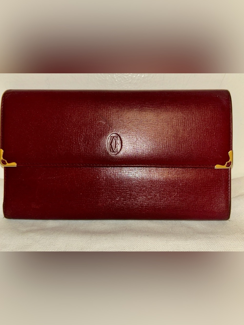 Cartier Burgundy Leather Must deCartier
Trifold Continental Wallet